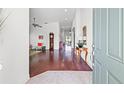 Inviting foyer with hardwood floors, elegant decor, and a glimpse into the spacious living areas at 13953 Thoroughbred Dr, Dade City, FL 33525