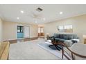 Bright living room featuring a ceiling fan, recessed lighting, and sliding glass door access at 1515 12Th Se Ct # 55, Largo, FL 33771