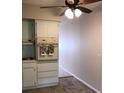 Bright kitchen area featuring ample cabinet storage and overhead lighting at 2450 Canadian Way # 6, Clearwater, FL 33763