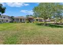 Charming single-story home featuring a well-manicured lawn and inviting facade at 3060 Sutton Woods Dr, Plant City, FL 33566