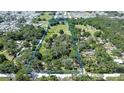 Expansive parcel of land with mature trees and a lush green meadow, ready for your dream home at 37348 Tucker Rd, Zephyrhills, FL 33541