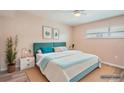 Cozy bedroom with soft pink walls, stylish decor, and comfortable furnishings at 4018 Indianapolis Ne St, St Petersburg, FL 33703