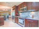 Modern kitchen featuring stainless steel appliances, granite countertops, and ample cabinet space at 6328 S Harold Ave, Tampa, FL 33616