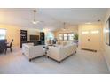 Bright and airy living room featuring tile flooring, high ceilings, and large windows at 6328 S Harold Ave, Tampa, FL 33616