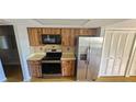 A bright kitchen features stainless steel appliances and plenty of cabinet space at 8623 Stonehedge Way, Hudson, FL 34667