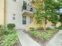 Charming townhouse exterior with a private balcony overlooking a well-maintained landscape and a welcoming entrance at 956 Sombra St, Tampa, FL 33619