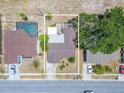 Aerial view outlining the property, showcasing the pool, landscaping, and surrounding neighborhood at 1034 Mandarin Dr, Holiday, FL 34691