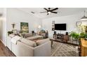 Spacious living room featuring a comfortable sectional sofa and modern entertainment center at 1050 22Nd N Ave, St Petersburg, FL 33704