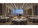 Elegant event space features a grand piano, ambient lighting, and city views through large windows at 1101 E Jackson St # 2015, Tampa, FL 33602