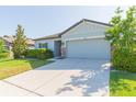 Lovely single-story home boasting of a well-manicured lawn and stone-accented details at 19032 Malinche Loop, Spring Hill, FL 34610