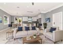 Bright and airy living room with modern decor flowing seamlessly into a well-equipped kitchen at 212 W Floribraska Ave, Tampa, FL 33603