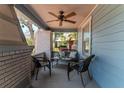 Relaxing covered porch with comfortable seating, ceiling fan, and stylish brick columns at 2638 Burlington N Ave, St Petersburg, FL 33713