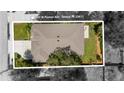 Aerial view of home showcasing roof, lot size, and proximity to other homes in the neighborhood at 3605 W Paxton Ave, Tampa, FL 33611