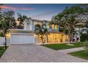 Charming two-story home featuring a welcoming front porch, paved driveway and an attached two-car garage at 3711 W Barcelona St, Tampa, FL 33629