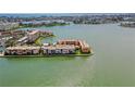 Stunning aerial view of waterfront condos with lush landscaping and ocean views at 7645 Sun Island S Dr # 207, South Pasadena, FL 33707