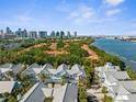 Aerial view of a beautiful community with a waterfront view and city skyline in the background at 916 Hemingway Cir, Tampa, FL 33602