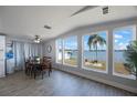 Cozy dining room with a view of the beautiful lake and a well-manicured backyard at 9416 Star Gazer Ln, Riverview, FL 33578
