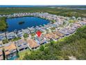 This aerial view showcases the home's location near a serene lake and beautiful surroundings at 1025 Seagrape Dr, Ruskin, FL 33570