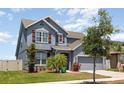 Inviting two-story residence boasting a lush front yard, a two-car garage and attractive architectural details at 11938 Bahia Valley Dr, Riverview, FL 33579