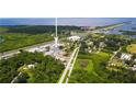 Overhead view showcasing the location's proximity to lush greenery, a major highway, and coastal waters at 1237 Savona Ne Dr, St Petersburg, FL 33702