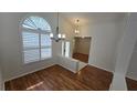 Bright entryway featuring wood floors, high ceilings, and decorative chandelier at 15209 Arbor Hollow Dr, Odessa, FL 33556