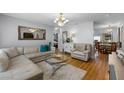 Bright living room boasts hardwood floors, neutral colors, and lots of natural light at 2167 Euclid E Cir, Clearwater, FL 33764