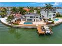 Beautiful waterfront property with a private pool, boat dock, and outdoor entertaining space at 2250 Donato Dr, Belleair Beach, FL 33786