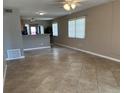 Well-lit living room featuring tile flooring with a breakfast bar overlooking the kitchen at 2434 Australia E Way # 22, Clearwater, FL 33763