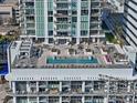 Rooftop pool and sundeck features ample seating and manicured landscaping at 301 1St S St # 2305, St Petersburg, FL 33701