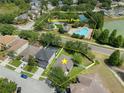 Aerial view showcasing the property's proximity to the community park, pool, and tennis courts at 32201 Brookstone Dr, Wesley Chapel, FL 33545