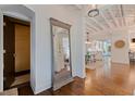 Elegant foyer with hardwood floors, high ceilings, decorative mirror, and open view to dining and kitchen at 341 14Th Ave Ne, St Petersburg, FL 33701