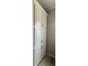 Floor to ceiling pantry cabinets featuring shaker style doors and simple hardware at 3722 Binnacle Dr, Tampa, FL 33611