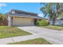 This two-story home offers a well-maintained lawn and inviting curb appeal with its neutral color palette at 4915 Pennsbury Dr, Tampa, FL 33624