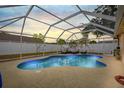 Relaxing screened-in pool with a covered lanai and plenty of seating for entertaining at 6507 61St E Dr, Palmetto, FL 34221