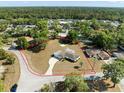 Large lot featuring a single-Gathering home with a sprawling lawn and mature trees, outlined in red at 7346 Hiawatha Pkwy, Spring Hill, FL 34606