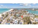 Aerial view showing the property's location near the beach and waterway in a coastal community at 121 86Th Ter, Treasure Island, FL 33706