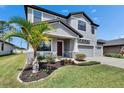 Lovely two-story home with a well-kept lawn, complete with a welcoming front porch and a spacious two-car garage at 12134 Creek Preserve Dr, Riverview, FL 33579