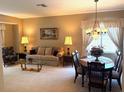 Comfortable living and dining area with coordinated furnishings and lots of natural light at 1765 Oak Pond Ct, Oldsmar, FL 34677