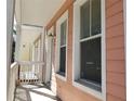 Charming multi-level townhome featuring a private porch with a calming ambiance and a relaxing outdoor space at 2002 E 5Th Ave # 110, Tampa, FL 33605