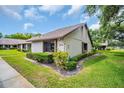 Beautiful condo exterior with mature landscaping and well-manicured lawn at 2506 Laurelwood Dr # 4C, Clearwater, FL 33763