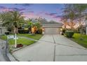 Well-maintained single-Gathering home with mature landscaping and a spacious driveway at 27338 Hollybrook Trl, Wesley Chapel, FL 33544
