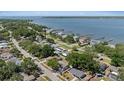 Aerial view of the property with a glimpse of the waterfront community and nearby docks at 324 Country Club Dr, Oldsmar, FL 34677