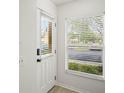 Bright entryway featuring a storm door with built-in blinds and a large window, creating a welcoming ambiance at 3437 Dragon View Ct, Valrico, FL 33594