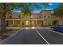 Charming townhome featuring a colorful exterior and well-maintained landscaping with convenient parking spaces at 3437 Dragon View Ct, Valrico, FL 33594