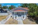 Beautiful bungalow with a classic covered porch, steps to the entrance, and fresh exterior paint at 4519 5Th S Ave, St Petersburg, FL 33711