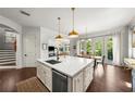 Bright kitchen boasts a center island, stainless steel appliances, and French doors leading to the outdoor area at 4804 W Beachway Dr, Tampa, FL 33609