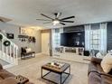 Inviting living room with modern decor, large TV, comfortable seating, and ample space for relaxation at 5316 Ladywell Ct, Tampa, FL 33624