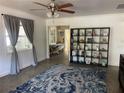 Bright living room featuring Terrazzo flooring, neutral color palette, ceiling fan and an open layout at 5725 2Nd N Ave, St Petersburg, FL 33710