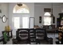 An interior view of the living room highlighting furniture, decor, and natural light at 63 Forest Wood Ct, Spring Hill, FL 34609