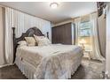 Comfortable bedroom featuring soft carpet, a window, and closet at 7603 N 53Rd St, Tampa, FL 33617